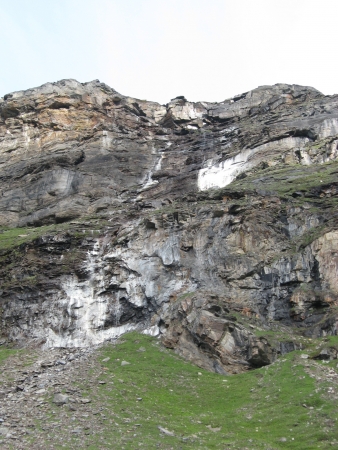 White rock crust along a cliff face